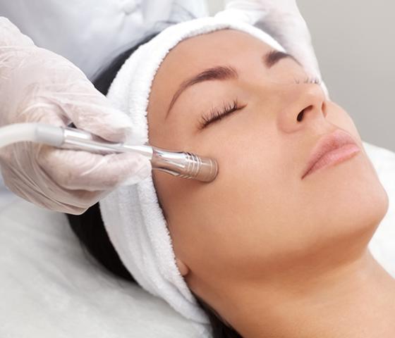 person having microdermabrasion treatment