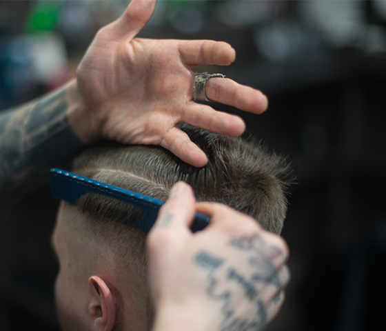 Barber cuts patients' hair. 