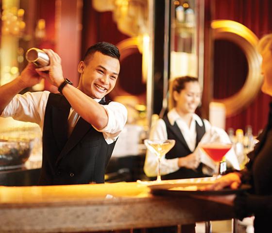 Image of man preparing beverage in a bar