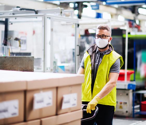protective masked warehouse worker
