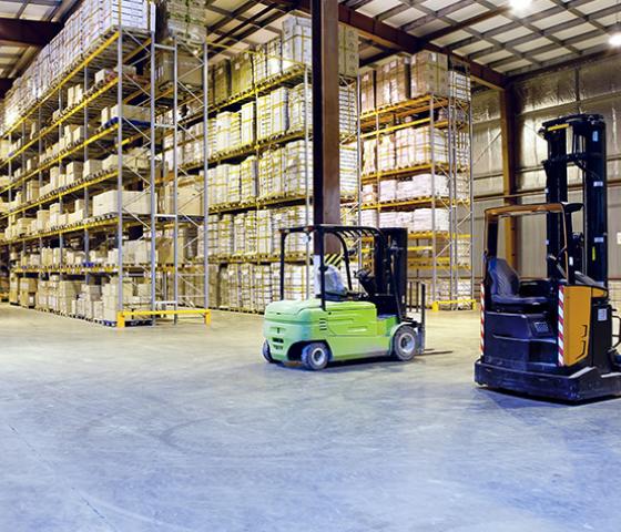 Image of 2 forklifts in a warehouse 