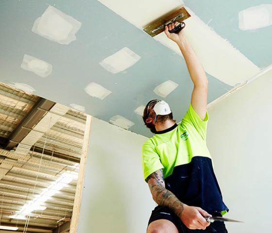 image of person installing ceiling 
