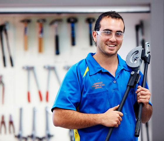 plumber holding equipment tool
