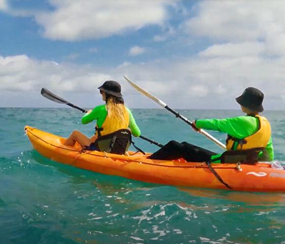 2 people in a kayak in the ocean